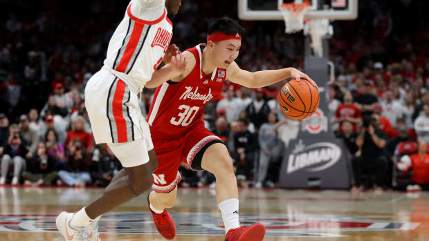 Feb 29, 2024; Columbus, Ohio, USA; Nebraska Cornhuskers guard Keisei Tominaga (30) dribbles past Ohio State Buckeyes guard Dale Bonner (4) during the first half at Value City Arena.